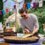 Chef Tom Hunt cuts a slice of the Eden Project's giant Coronation quiche